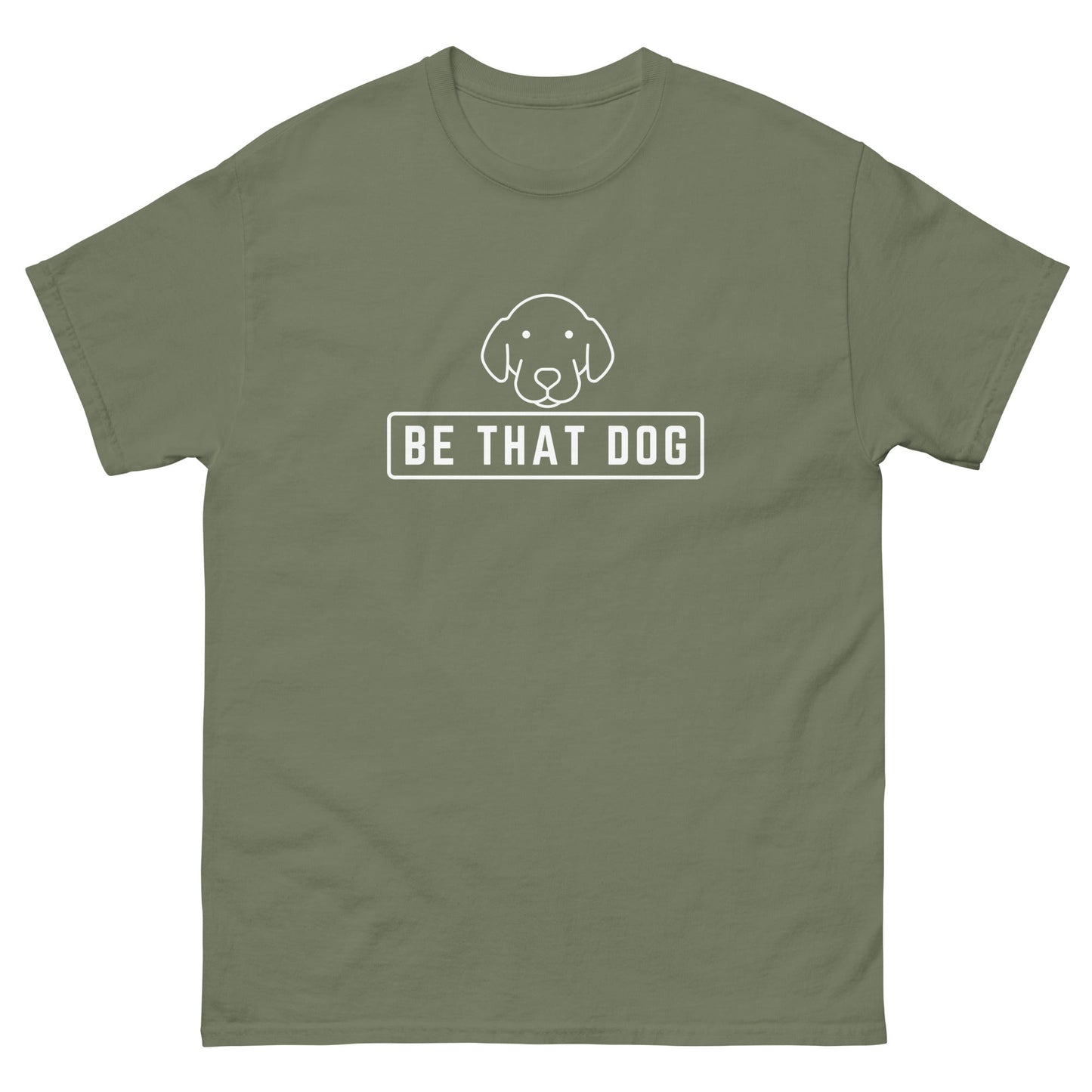 The "Be THAT Dog Minimalist Pup Face Tee" by THiNK LiKE A DOG® is a green 100% cotton shirt with a simple dog illustration and the phrase "Be That Dog," perfect for any confident dog lover.