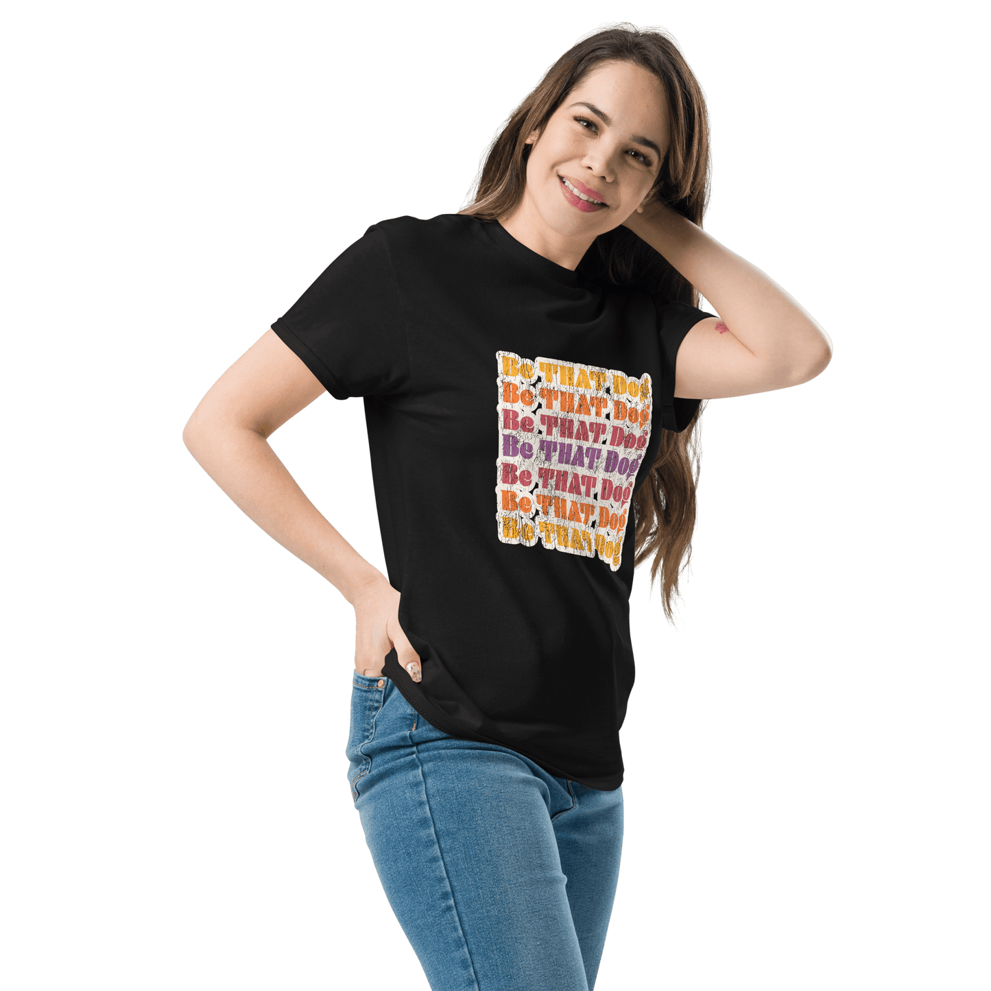 Person smiling with hand on hip, wearing a black '70s-inspired THiNK LiKE A DOG® unisex tee featuring colorful vintage-style text. Ideal for dog lovers who appreciate retro fashion. White backdrop.