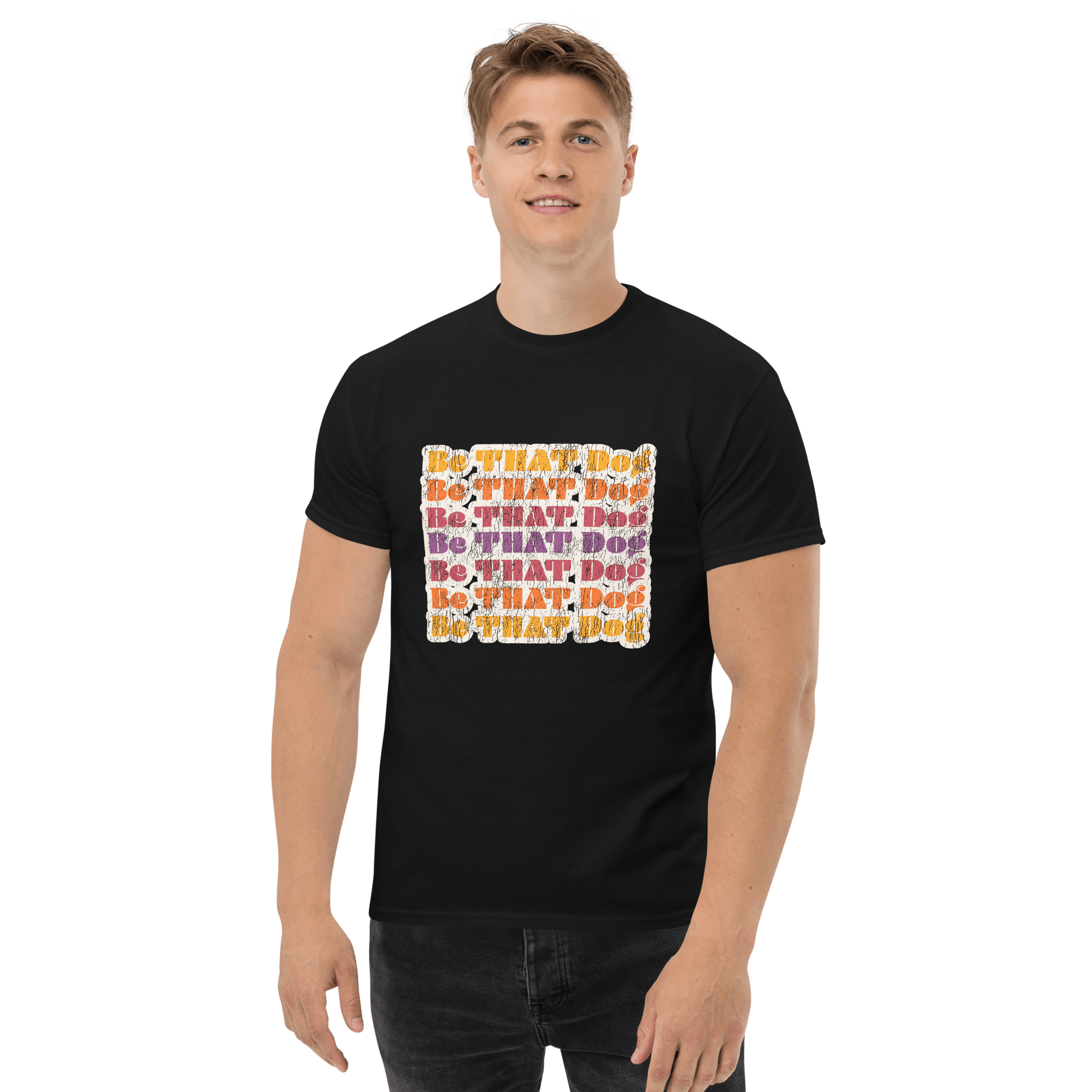A person wearing a retro unisex tee from THiNK LiKE A DOG® displays the vibrant slogan "Be THAT Do!" against a white background, featuring the ‘70s-inspired funny dog lover design.