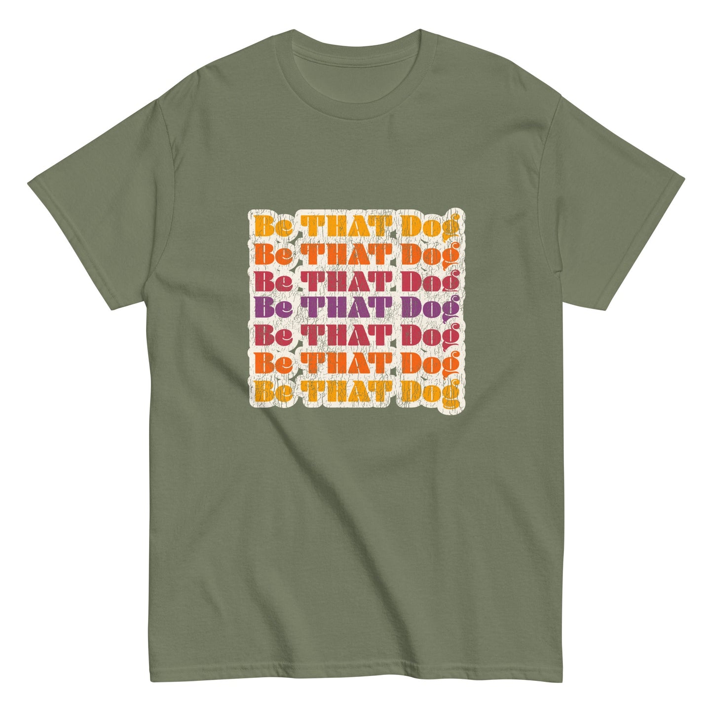 The THiNK LiKE A DOG® "Be That Dog Retro Unisex Tee" is a ‘70s-inspired green shirt featuring "Be THAT Dog" in yellow and purple text, arranged in a square pattern—ideal for those seeking a bold style statement.