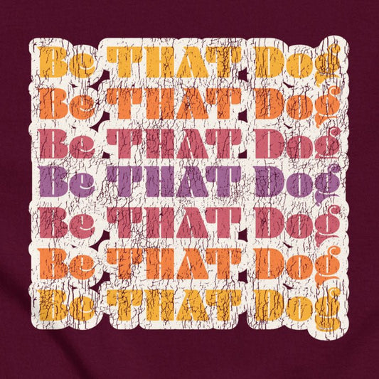 The THiNK LiKE A DOG® "Be That Dog Retro Unisex Tee" is a ‘70s-inspired shirt featuring distressed, colorful text. Perfect for giving your pup a vintage and stylish look.