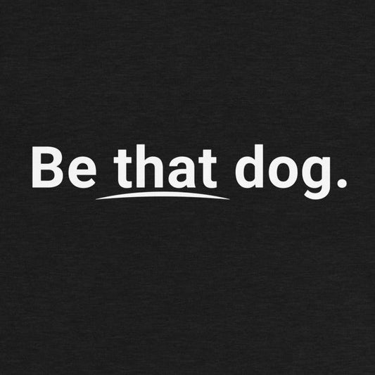 Text on a black background reads "Be that dog" with an underline beneath "that," showcasing a minimalist aesthetic ideal for the THiNK LiKE A DOG® Be That Dog Simple Statement Sweatshirt - Unisex Dog Lover Sweater.