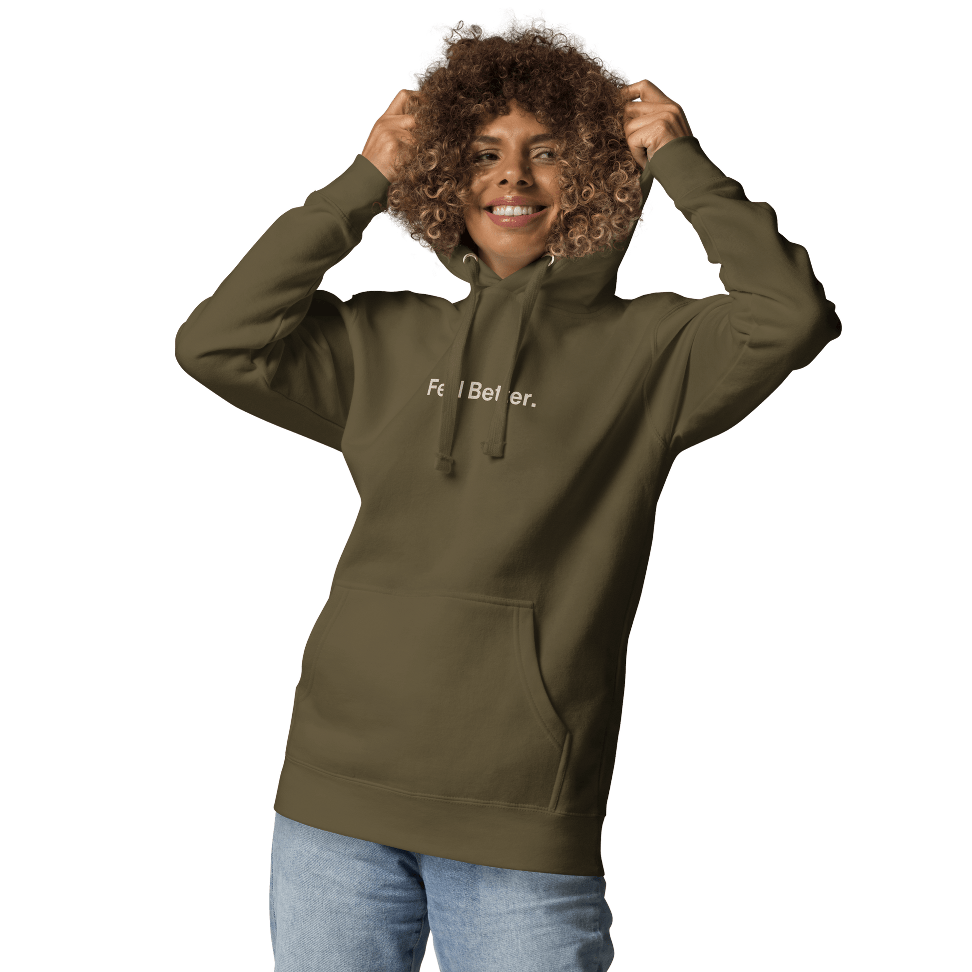 A curly-haired person smiles in a green "Feel Better Dog Lover Hoodie" from THiNK LiKE A DOG®, ideal for pet owners and dog moms, playfully showcasing joy while holding the hood.