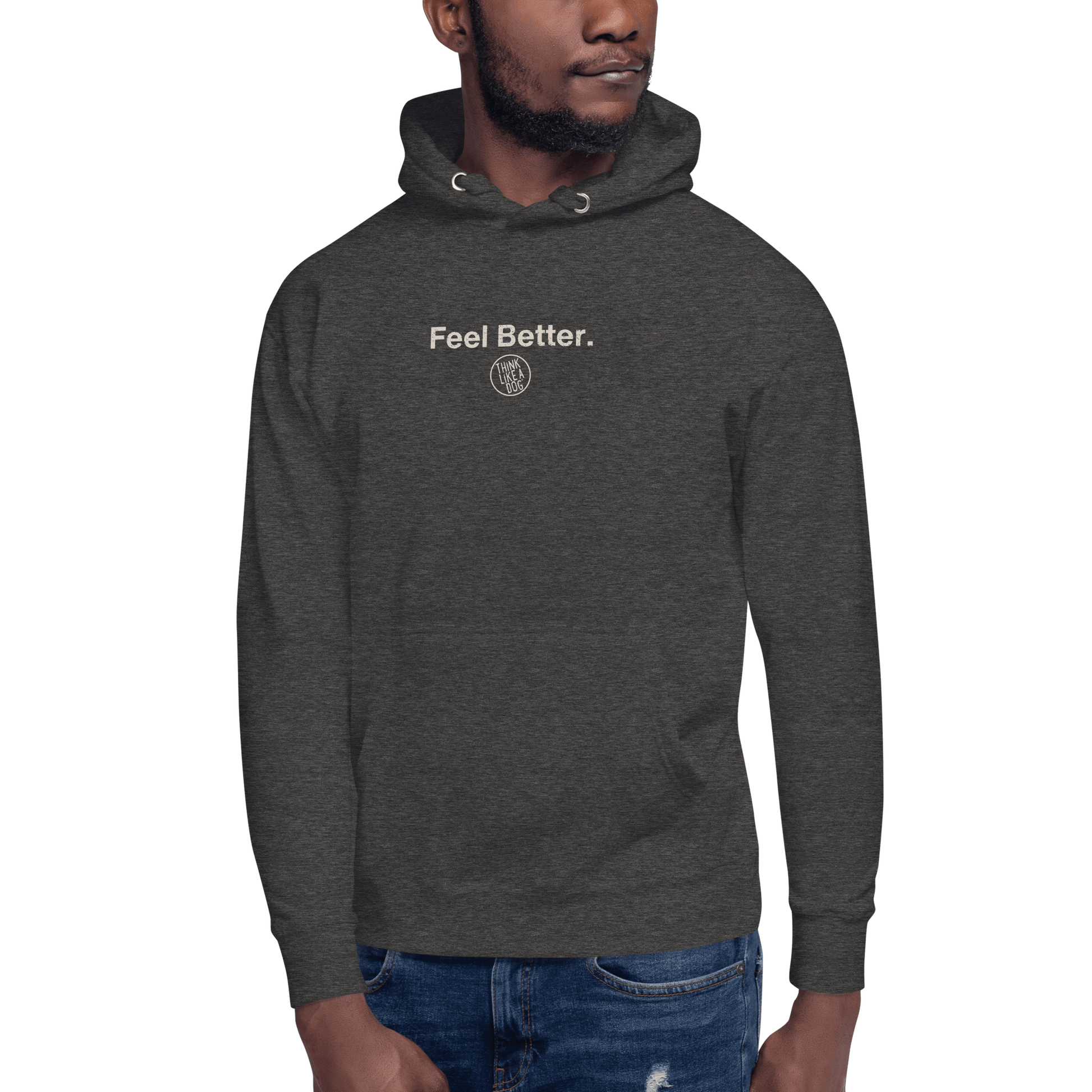A person wears a THiNK LiKE A DOG® charcoal "Feel Better Dog Lover Hoodie" with a small circular logo, perfect for pet parents. Paired with ripped blue jeans against a black background, this outfit is ideal for those who cherish canine companionship.