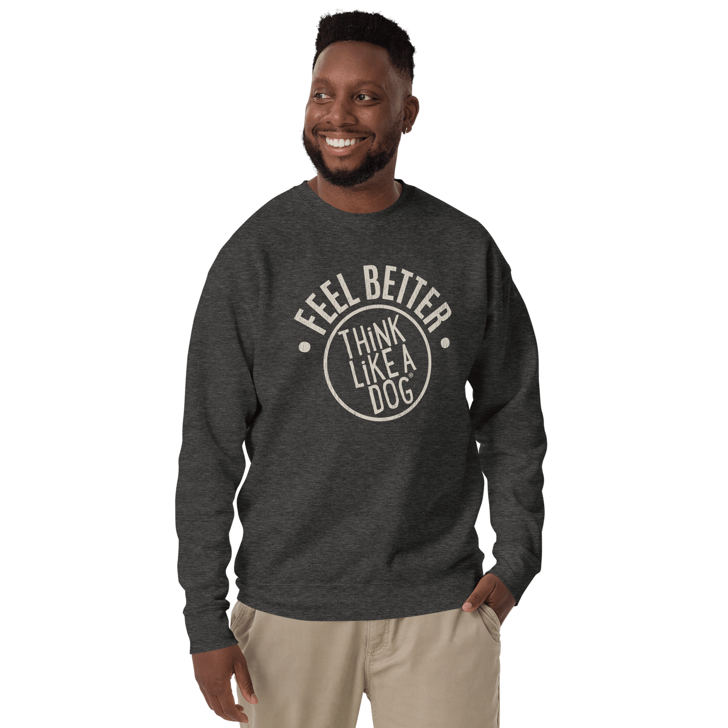 Wearing a dark Feel Better Dog Lover Sweatshirt by THiNK LiKE A DOG®, a man smiles warmly, standing against a plain background.