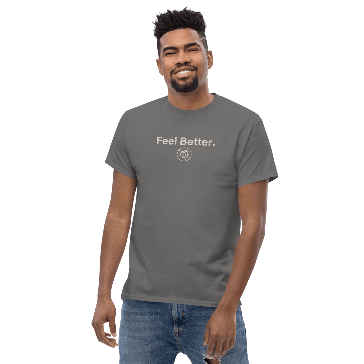 A man wearing a gray THiNK LiKE A DOG® T-shirt featuring the text "Feel Better." and a circular logo designed for dog moms.