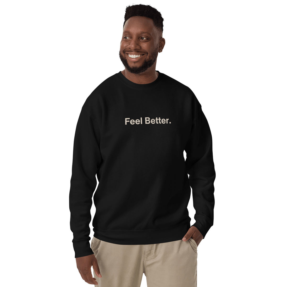 A man smiles while wearing the THiNK LiKE A DOG® Feel Better. Dog Lover Sweatshirt in black, featuring "Feel Better."…