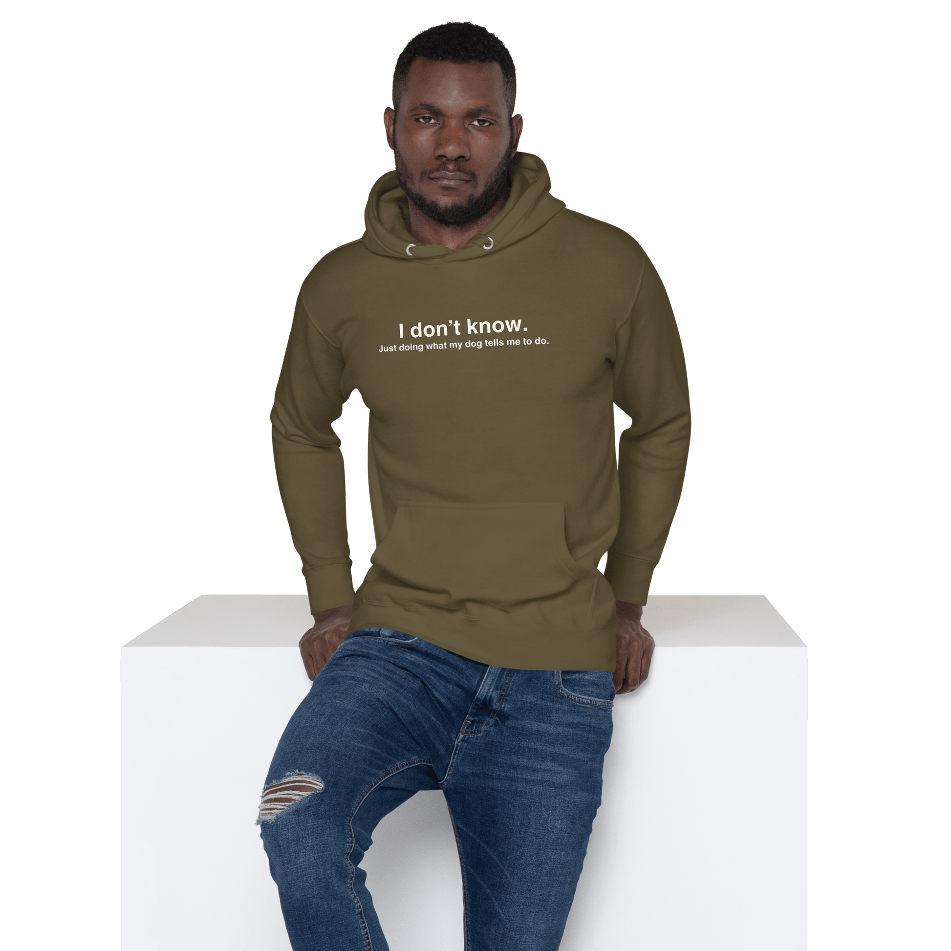 A man models the THiNK LiKE A DOG® Funny Dog Hoodie – Just Doing What My Dog Tells Me, featuring quirky green design and hilarious text—an ideal gift for dog lovers.