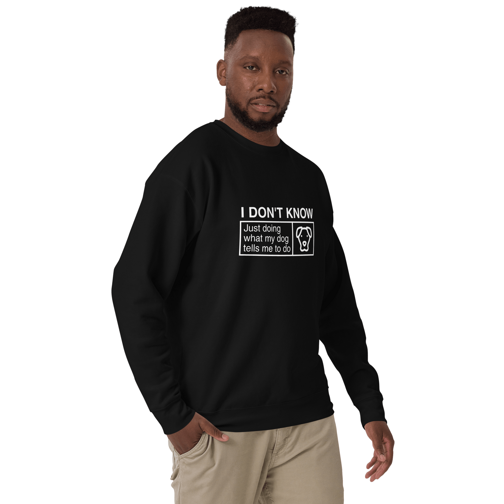 A man wears a THiNK LiKE A DOG® fleece sweatshirt reading "I Don’t Know, Just Doing What My Dog Tells Me" with a dog face graphic—ideal for fans of humorous dog lover apparel.