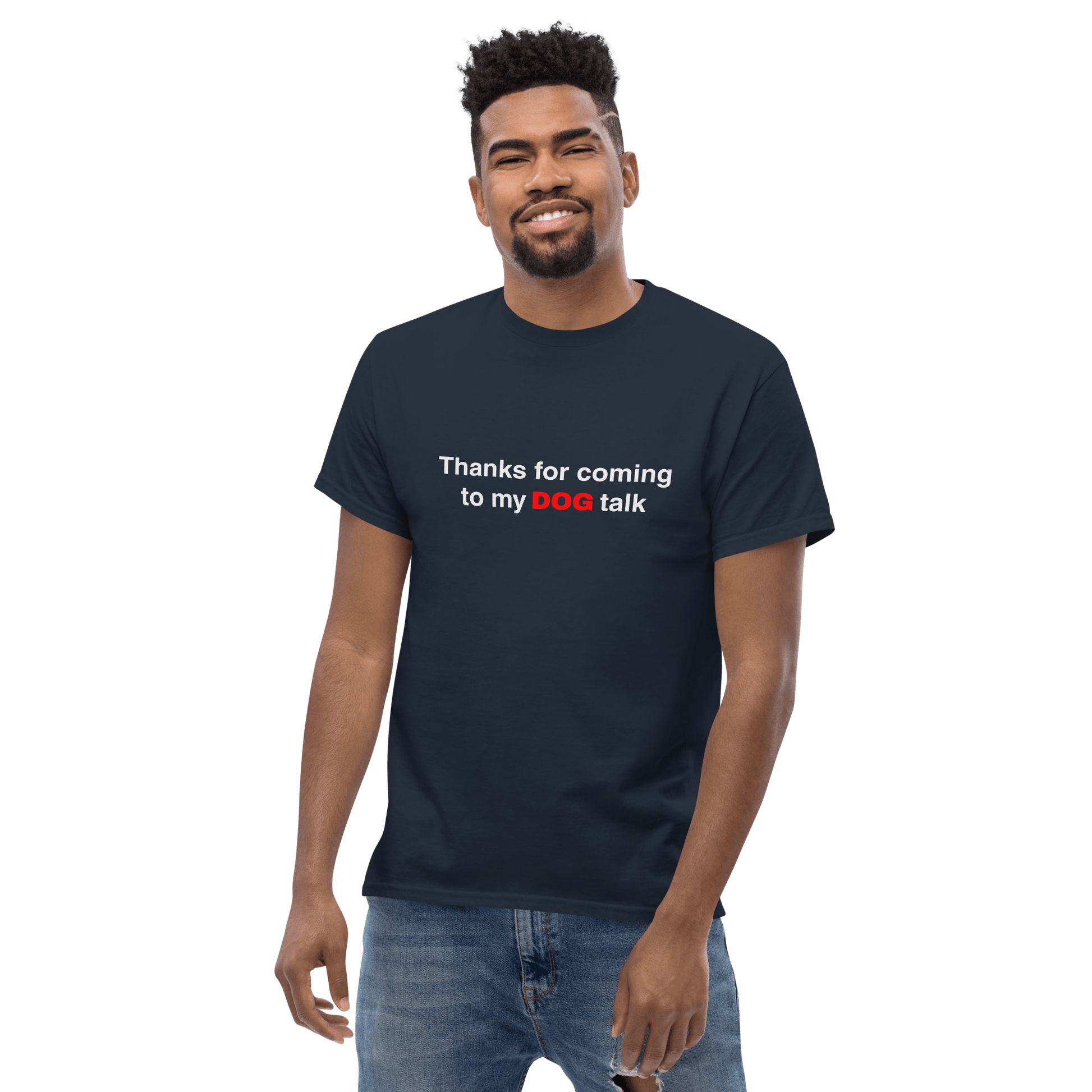 A man faces the camera wearing the THiNK LiKE A DOG® Funny Dog Shirt – "Thanks for Coming to My Dog Talk" with “DOG” in red—a humorous tee and perfect gift for dog lovers.