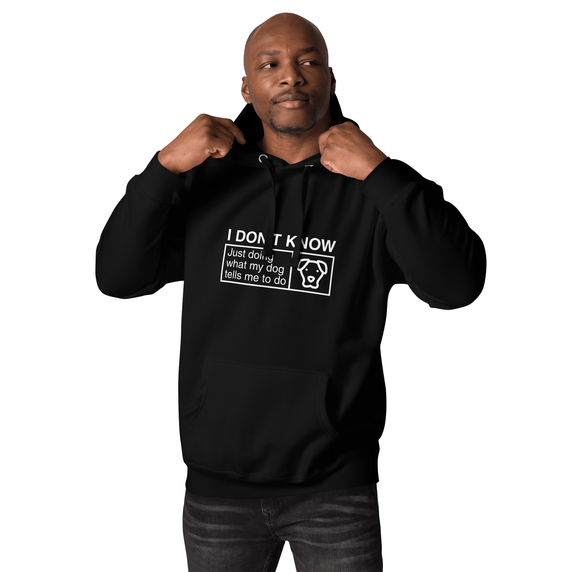 A man wears a black hoodie from THiNK LiKE A DOG® with the phrase, "I Don’t Know, Just Doing What My Dog Tells Me" and a dog image, making it an ideal gift for dog lovers.