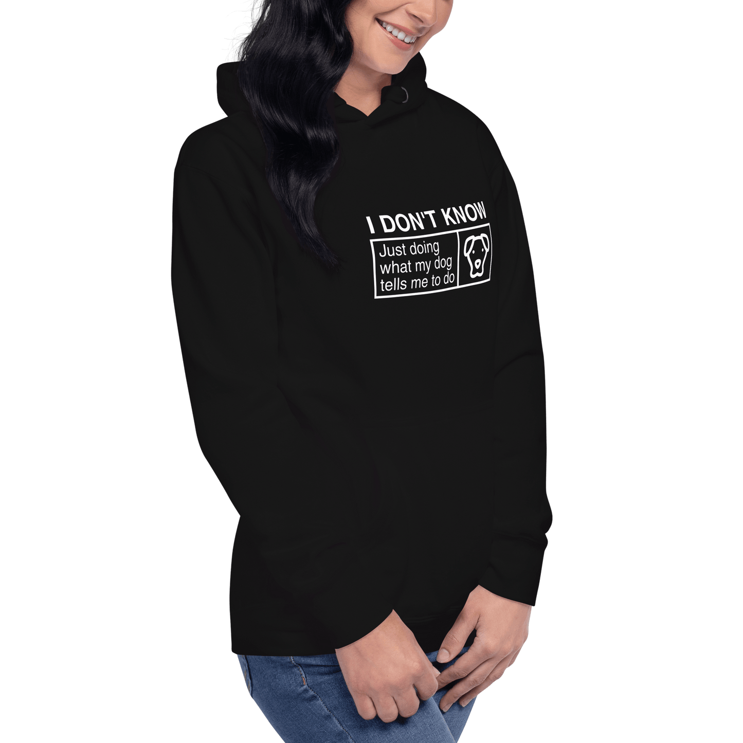 A person wears the black THiNK LiKE A DOG® Humorous Dog Hoodie, featuring "I Don’t Know, Just Doing What My Dog Tells Me" with a dog face graphic—perfect funny apparel for any dog lover’s gift.