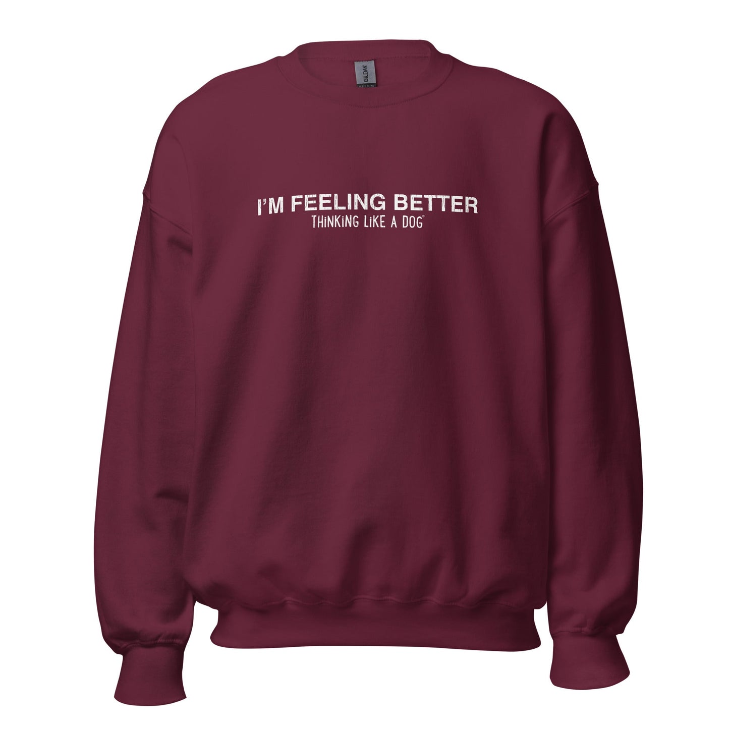 The "I’m Feeling Better, Thinking Like a Dog®" maroon sweatshirt by THiNK LiKE A DOG® features white text on the front. It blends cozy comfort with a vintage touch, making it the perfect gift for dog lovers and fans of inspirational comfort apparel.