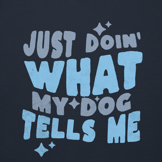 On a blue background, "Just doin' what my dog tells me" is written in large, stylized font with small decorative…