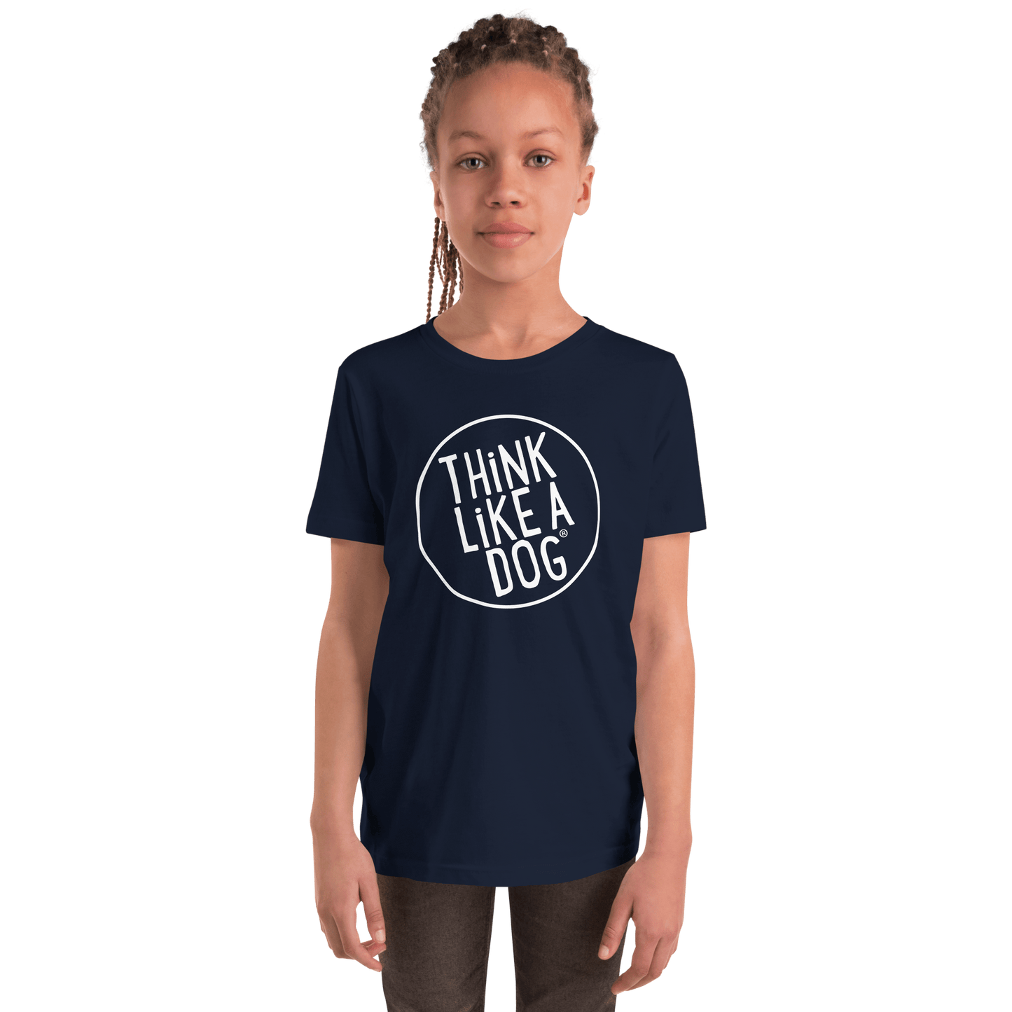 A dog-loving kid sports a navy blue Kids' Short Sleeve T-Shirt with the "Think Like a Dog" white logo, capturing the THiNK LiKE A DOG® spirit.