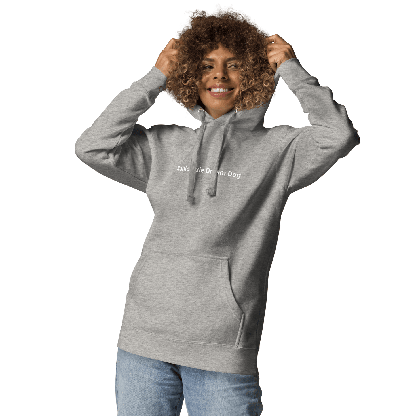 A dog lover beams, adjusting the hood of their gray THiNK LiKE A DOG® "Manic Pixie Dream Dog" hoodie, perfectly paired with denim jeans—minimalist dog-themed apparel for casual comfort.