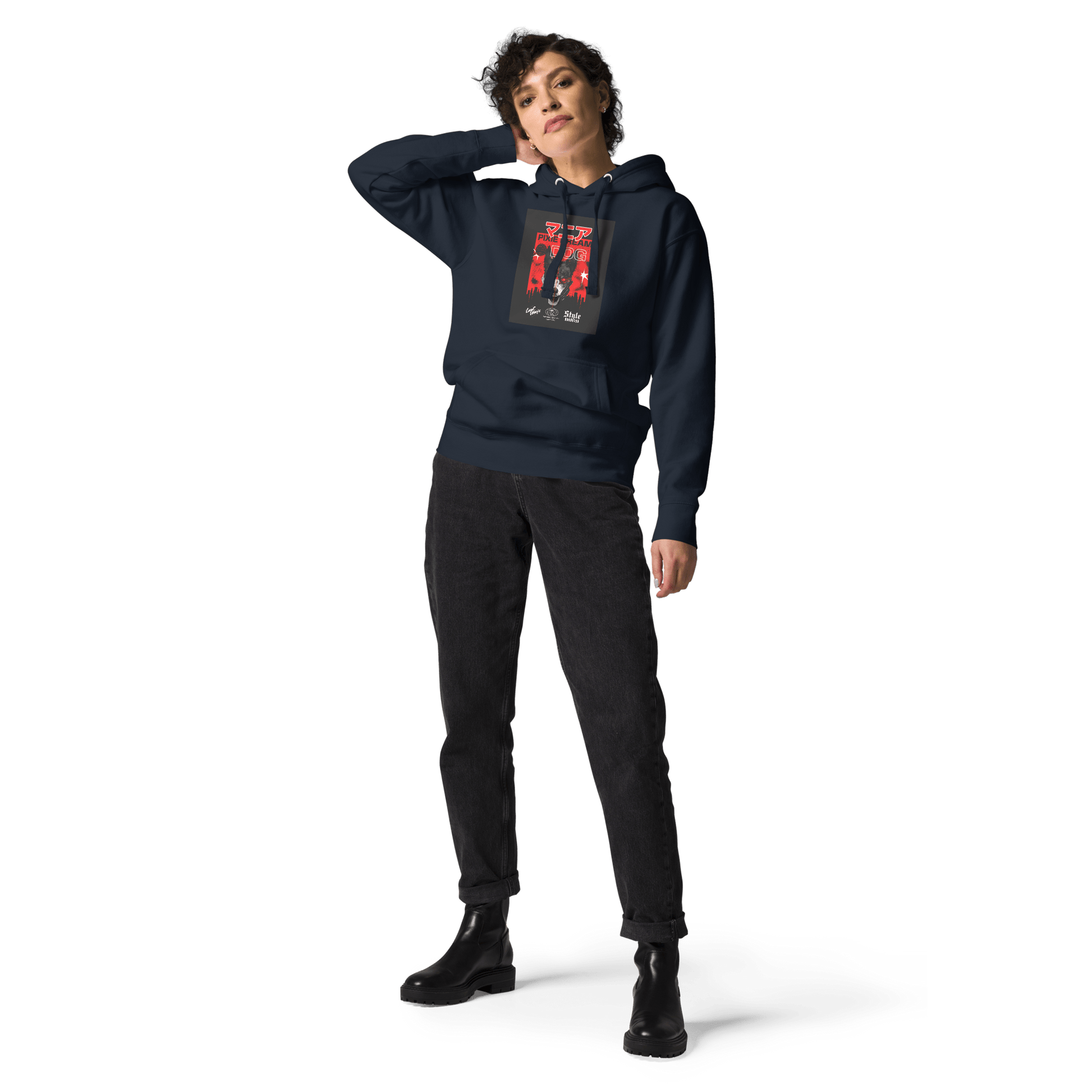 Sporting THiNK LiKE A DOG®'s Manic Pixie Dream Dog Kanji Hoodie in navy, a person stands against a sleek black background, hand behind head, paired with black jeans and boots.