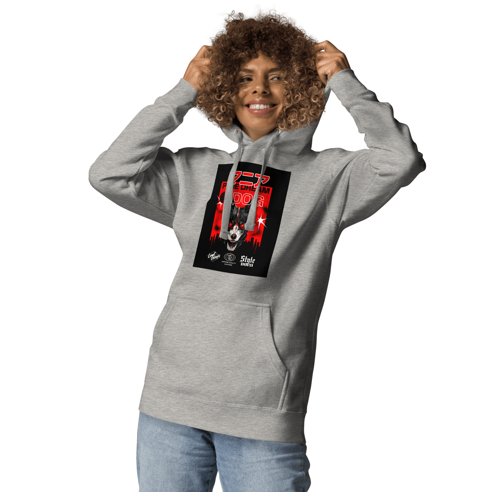 Wearing the Manic Pixie Dream Dog Kanji Hoodie from THiNK LiKE A DOG®, a person pairs it with blue jeans. The gray streetwear piece features a red-accented, Kanji-inspired design. Posing with hands near the hood, they give off an effortlessly cool vibe.