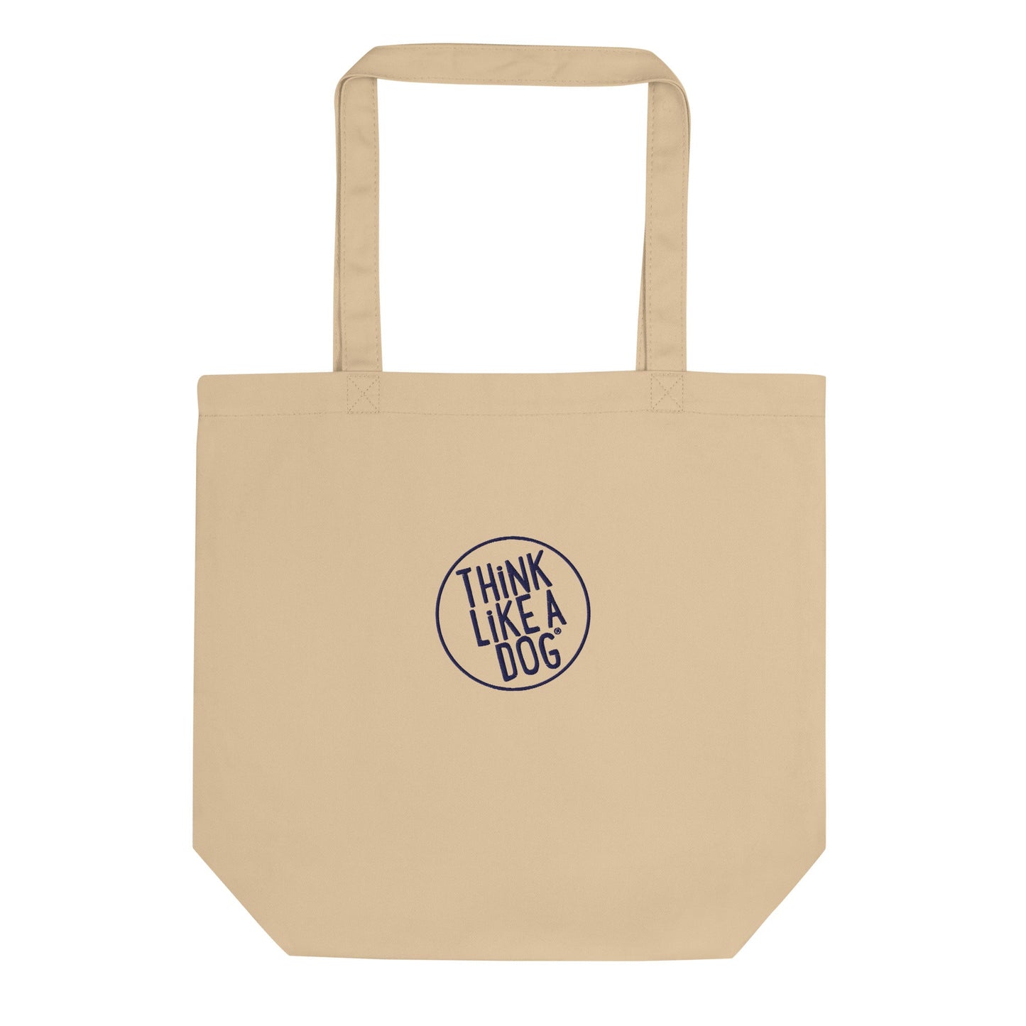 The THiNK LiKE A DOG® Eco-Friendly Beige Tote Bag, featuring long handles and crafted from durable materials, boasts an embroidered logo in the center that reads "THINK LIKE A DOG.