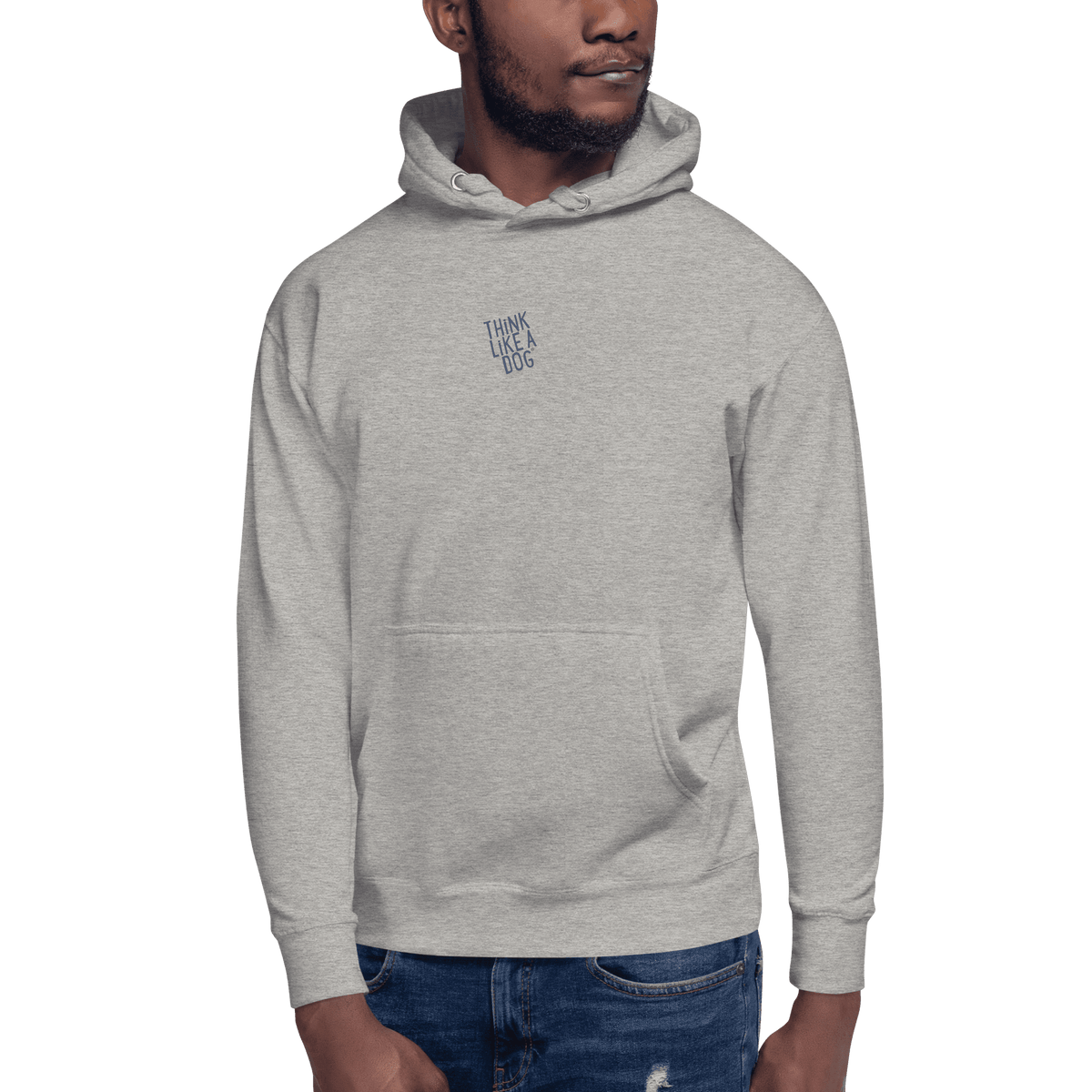Man wearing the THiNK LiKE A DOG® — Carbon Grey Hoodie in light gray, featuring "THINK LIKE A DOG" text…