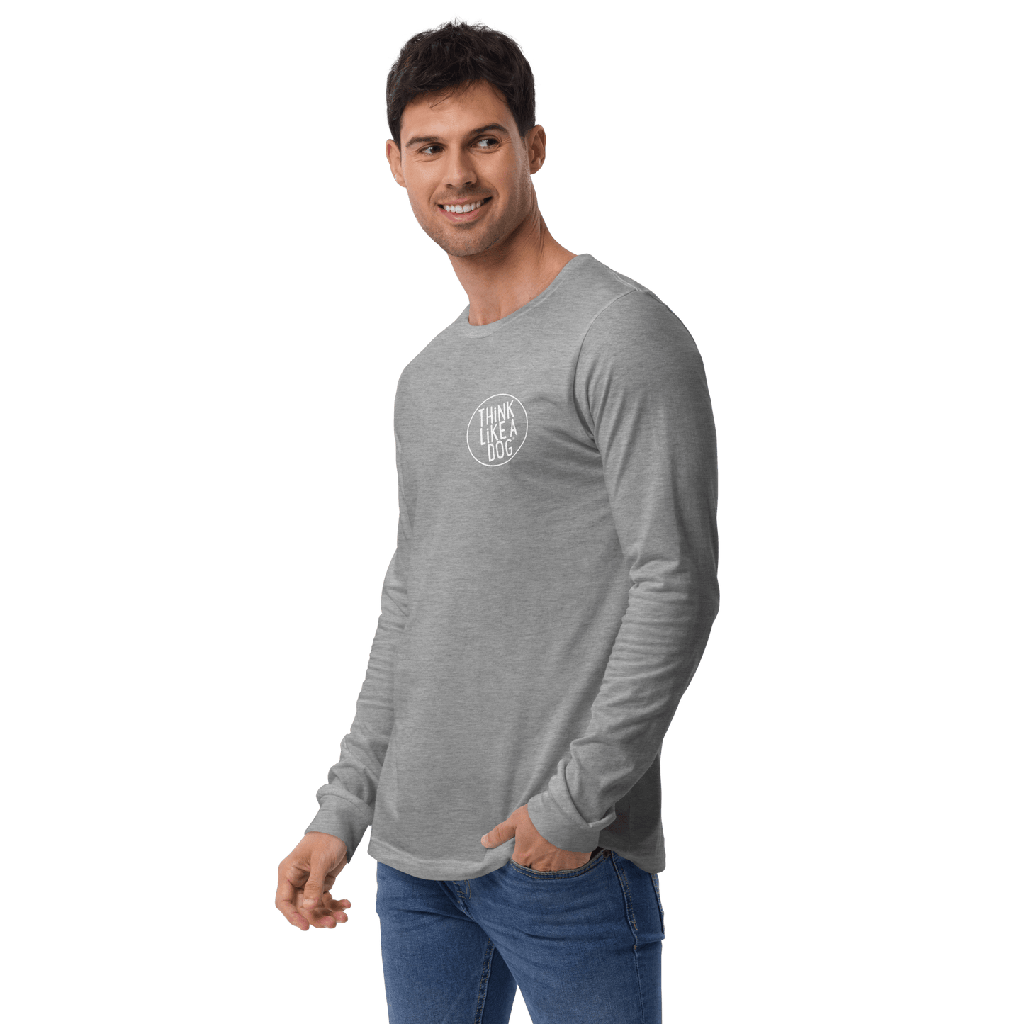 Wearing a THiNK LiKE A DOG® Minimalist Dog Lover Shirt, a gray unisex long sleeve tee, someone in blue jeans stands against a green background and gazes sideways.