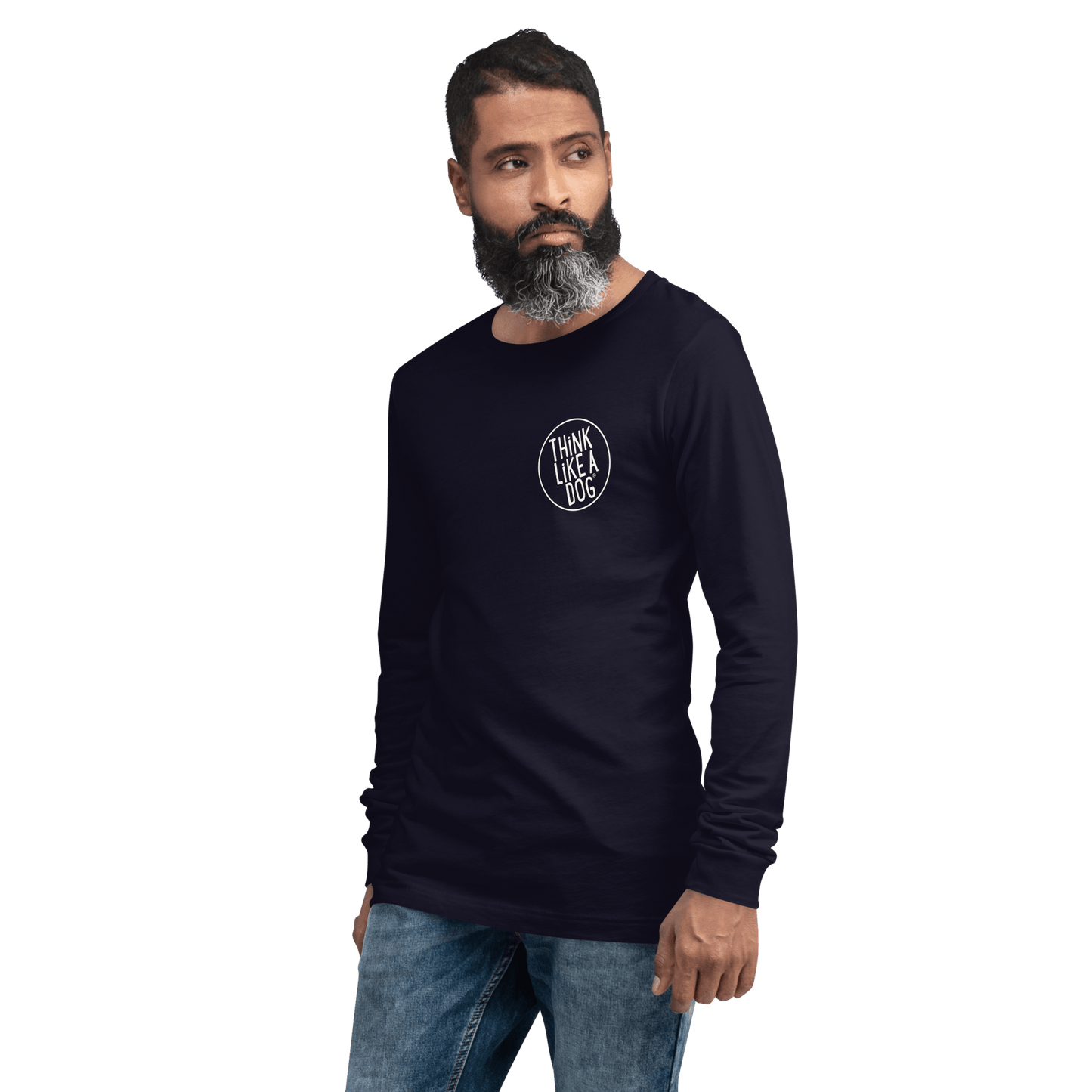 A bearded man models a navy THiNK LiKE A DOG® Long Sleeve Tee, epitomizing the true Minimalist Dog Lover Shirt. Paired with blue jeans, its understated design shines against a green backdrop.