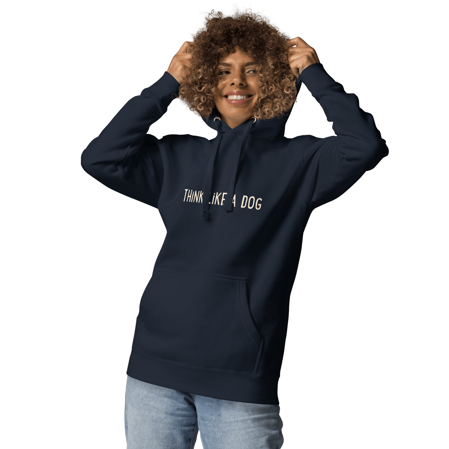A smiling person wears the THiNK LiKE A DOG® Think Like a Dog Hoodie – Papaya Whip Logo, a cozy unisex fleece with "THINK…