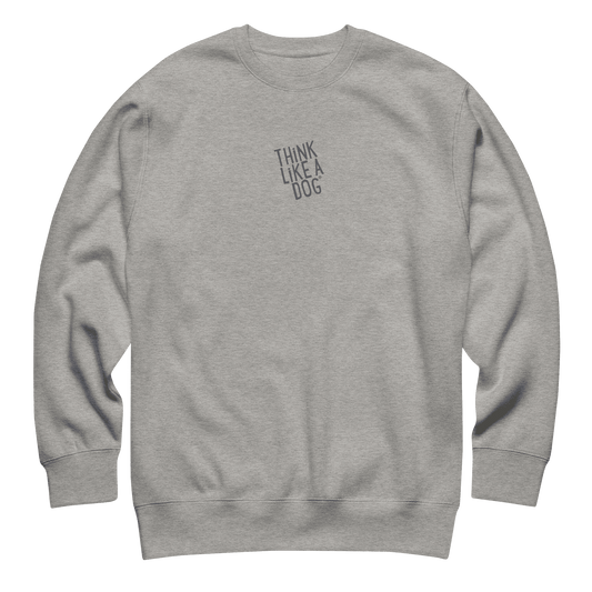 The THiNK LiKE A DOG® Think Like a Dog Sweatshirt — Everyday Comfort is a cozy unisex cotton fleece crewneck with "THINK LIKE A DOG" in small, uppercase letters on the left chest.