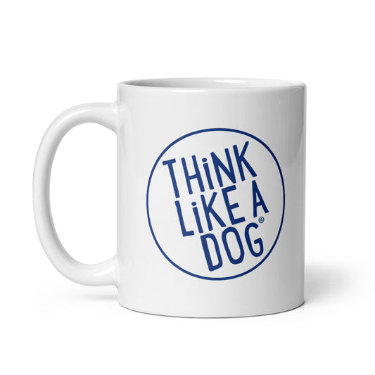 The Dog Lover Mug – Think Like a Dog Navy Logo by THiNK LiKE A DOG® is a white ceramic mug with an uppercase blue circular logo—perfect for dog moms or any dog enthusiast.