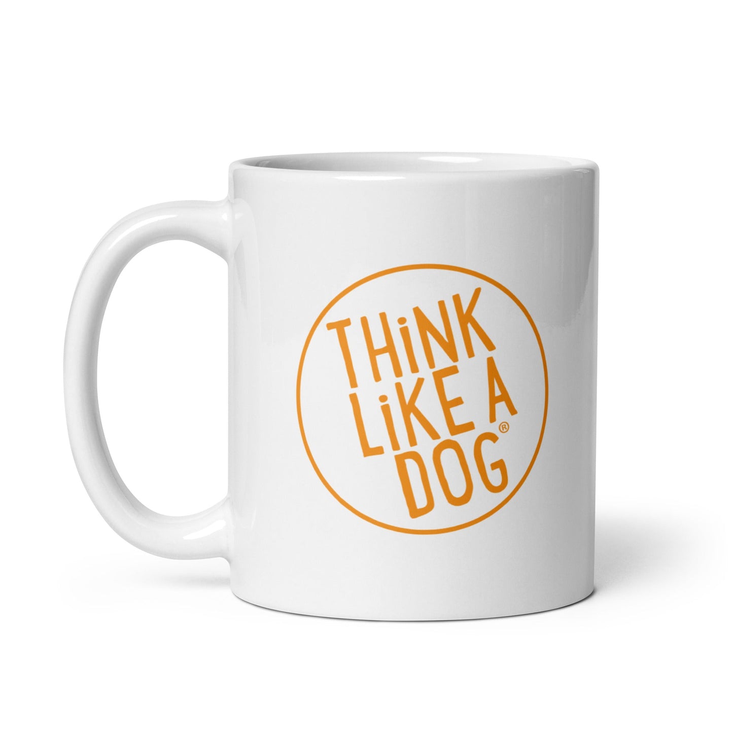 The THiNK LiKE A DOG® Think Like A Dog Mug – Vibrant Orange Logo is a white ceramic mug with a large handle, featuring "THINK LIKE A DOG" in bold orange inside a circle—ideal gift for dog lovers.