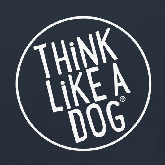 White text on a dark background reads "THiNK LiKE A DOG" inside a white circle. Perfect for dog lovers, this design is featured on the THiNK LiKE A DOG® Classic Men's Tee with White THiNK LiKE A DOG Logo, made from breathable cotton.