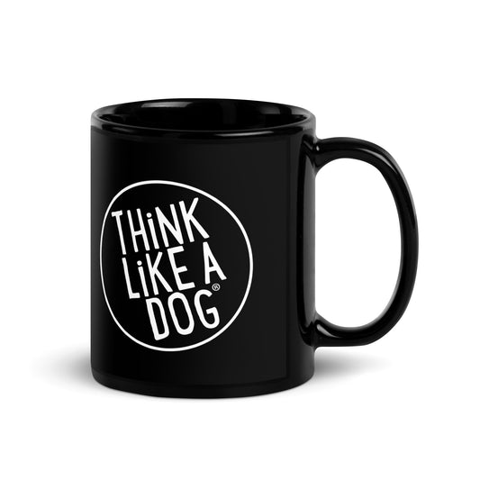 The THiNK LiKE A DOG® Black Mug features a minimalist white logo with the phrase "Think Like a Dog" in a circle. It's perfect for dog lovers who value simplicity and style in their daily coffee rituals.