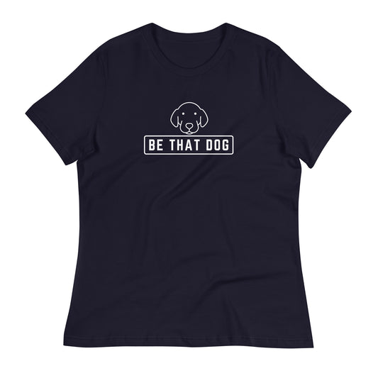 The Be THAT Dog Minimalist Women’s Relaxed T-Shirt by THiNK LiKE A DOG® is a stylish tee made from ultra-soft cotton, showcasing a minimalist dog design above the phrase "BE THAT DOG" in white.