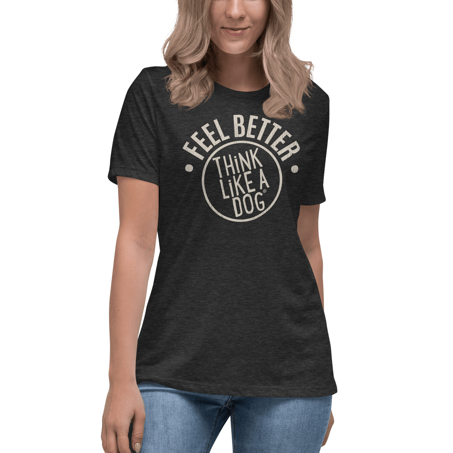 A woman in a THiNK LiKE A DOG® Feel Better Women's T-Shirt, emblazoned with "Feel Better, Think Like a Dog," pairs it effortlessly with blue jeans. This ultra-soft black tee is the perfect must-have for dog moms and animal enthusiasts.