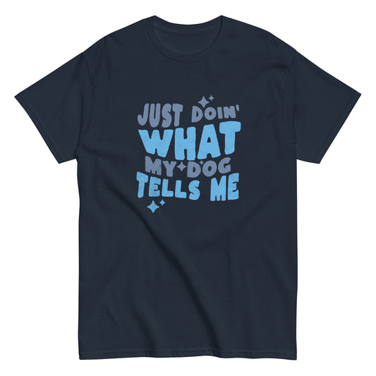 The THiNK LiKE A DOG® Funny Dog Shirt – Just Doin' What My Dog Tells Me features bold light blue text on navy blue, making it a perfect unisex tee for any dog lover’s collection or as a humorous gift.