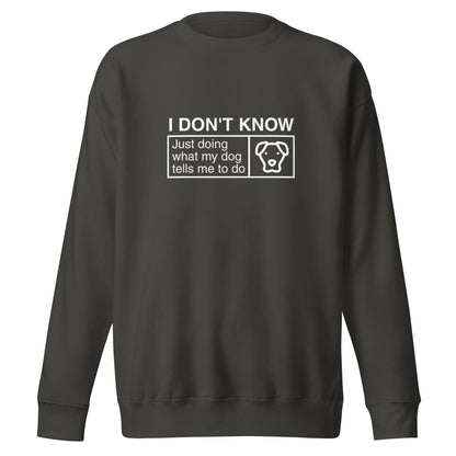 The THiNK LiKE A DOG® Funny Dog Lover Sweatshirt – ‘I Don’t Know, Just Doing What My Dog Tells Me To Do’ is a black sweatshirt featuring the humorous text: "I DON'T KNOW, Just doing what my dog tells me to do" alongside a charming illustration of a dog's face in white. This playful and witty dog-themed sweatshirt provides a cozy fit, making it an exceptional gift for any dog enthusiast.