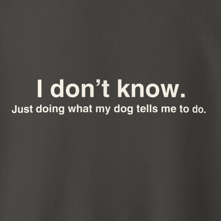 Text on a dark background: "I don’t know. Just doing what my dog tells me to do." Perfect for dog lovers, the THiNK LiKE A DOG® Funny Dog-Themed Sweatshirt adds humor to your wardrobe.