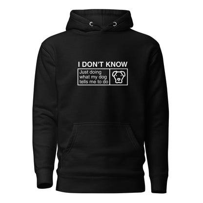 The Humorous Dog Hoodie by THiNK LiKE A DOG® features a black fabric with white text that reads, "I DON’T KNOW, Just Doing What My Dog Tells Me To Do," accompanied by an image of a dog's face inside a box. This whimsical hoodie is perfect for fans of cute and quirky dog-themed apparel.