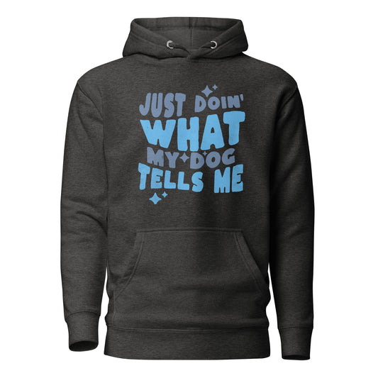 Introducing the "Just Doing What My Dog Tells Me" Hoodie from THiNK LiKE A DOG® – a dark gray hoodie featuring light blue text that reads "Just Doin' What My Dog Tells Me" on the front. This fun dog lover apparel is perfect for anyone who can't resist a humorous, dog-themed shirt.