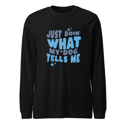 The THiNK LiKE A DOG® Quirky Dog-Themed Long Sleeve Shirt features blue text that reads "Just doin' what my dog tells me," adorned with small star accents on a black long-sleeve shirt. This funny dog shirt is perfect for showcasing your love for your furry friend while staying comfy.