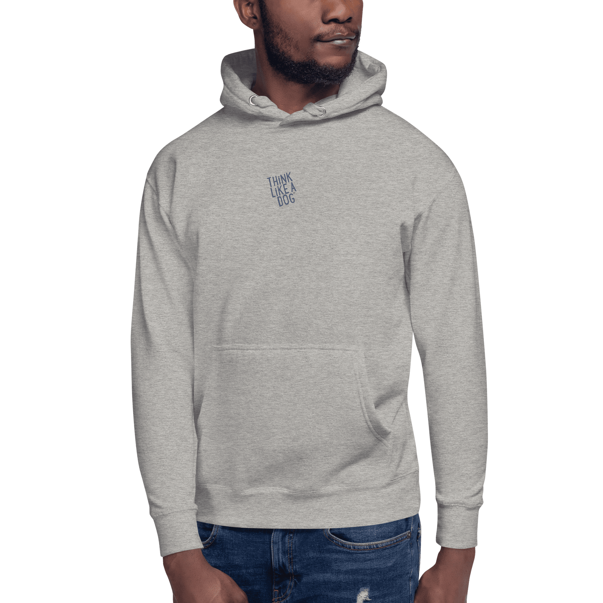Man wearing the THiNK LiKE A DOG® Think Like a Dog Hoodie — Everyday Comfort in light gray, featuring "THINK LIKE A DOG" text on the upper chest, standing against a plain background.
