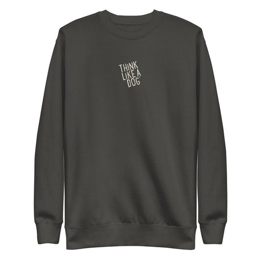 The Think Like a Dog Sweatshirt — Everyday Comfort by THiNK LiKE A DOG® is a dark gray unisex crewneck with "THINK LIKE A DOG" in small white letters diagonally on the chest—an ideal cozy fleece for any dog lover.
