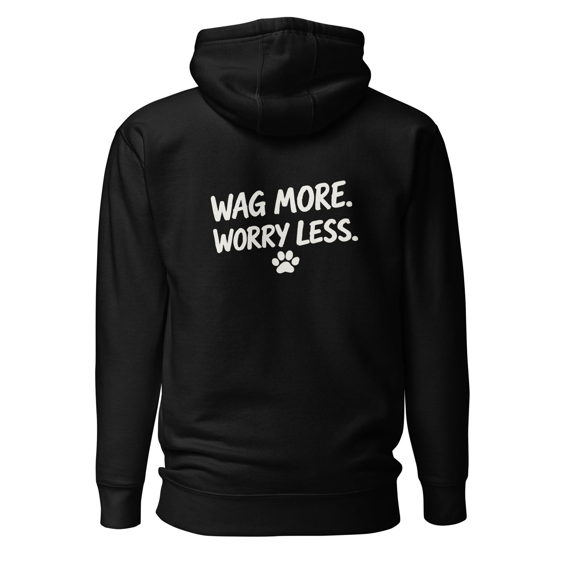 Black Wag More. Worry Less. hoodie, back view — white brush-script slogan and paw print between the shoulders.