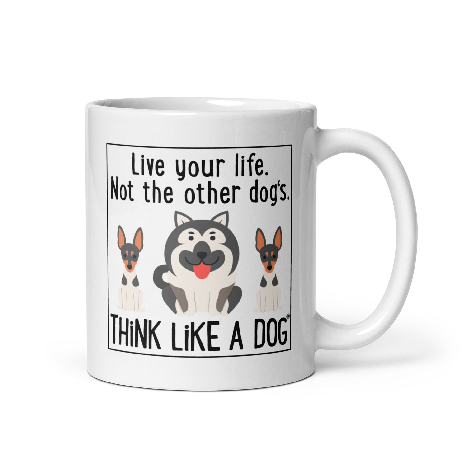 THiNK LiKE A DOG® White glossy Mug "live your life. not the other dog's." featuring images of three cartoon dogs, two resembling German Shepherds and one a gray Hus