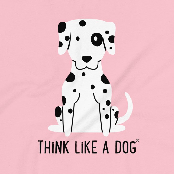 The Chic Pink Relaxed Fit T-Shirt from THiNK LiKE A DOG® features an adorable Dalmatian design with black spots on a pink background, perfect for dog lovers.