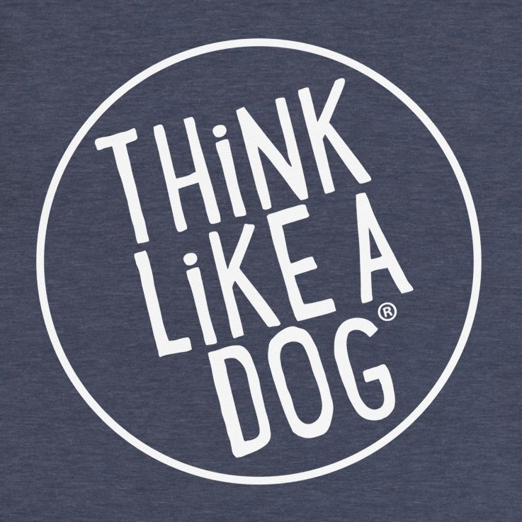 Featuring a small white "Think Like A Dog" logo by THiNK LiKE A DOG® on a circular design with a dark background, this unisex long sleeve tee offers stylish comfort for any casual outing – perfect for dog lovers.